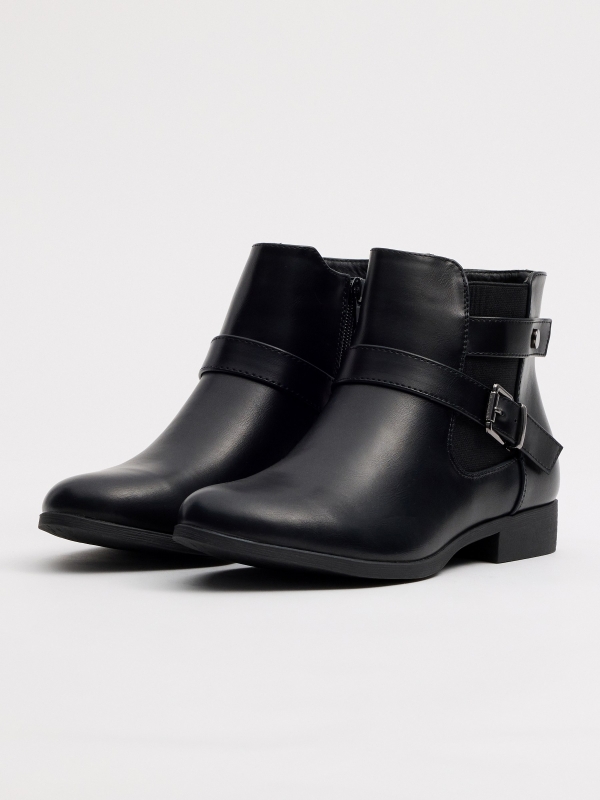 Classic elastic ankle boot with crossed buckles 45º front view