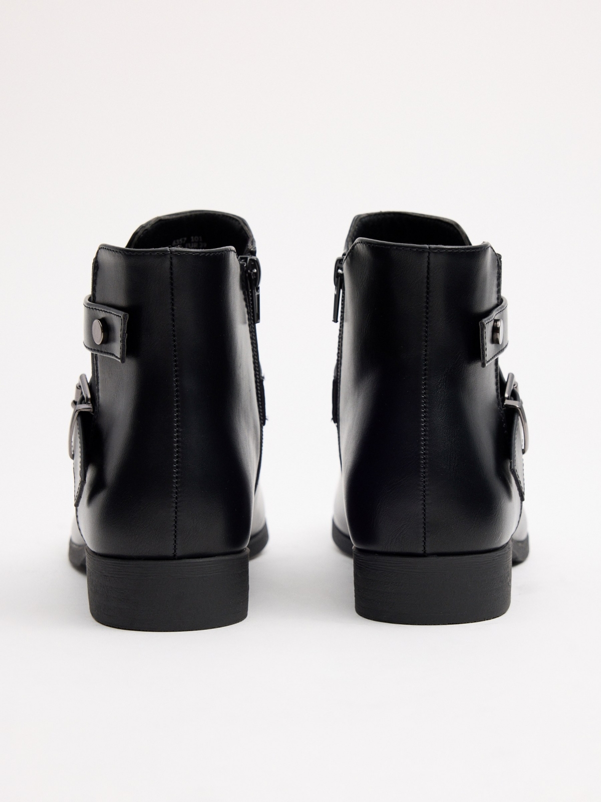 Classic elastic ankle boot with crossed buckles detail view