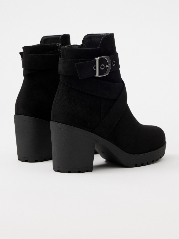 Black ankle boot with crossed straps and buckle black 45º back view