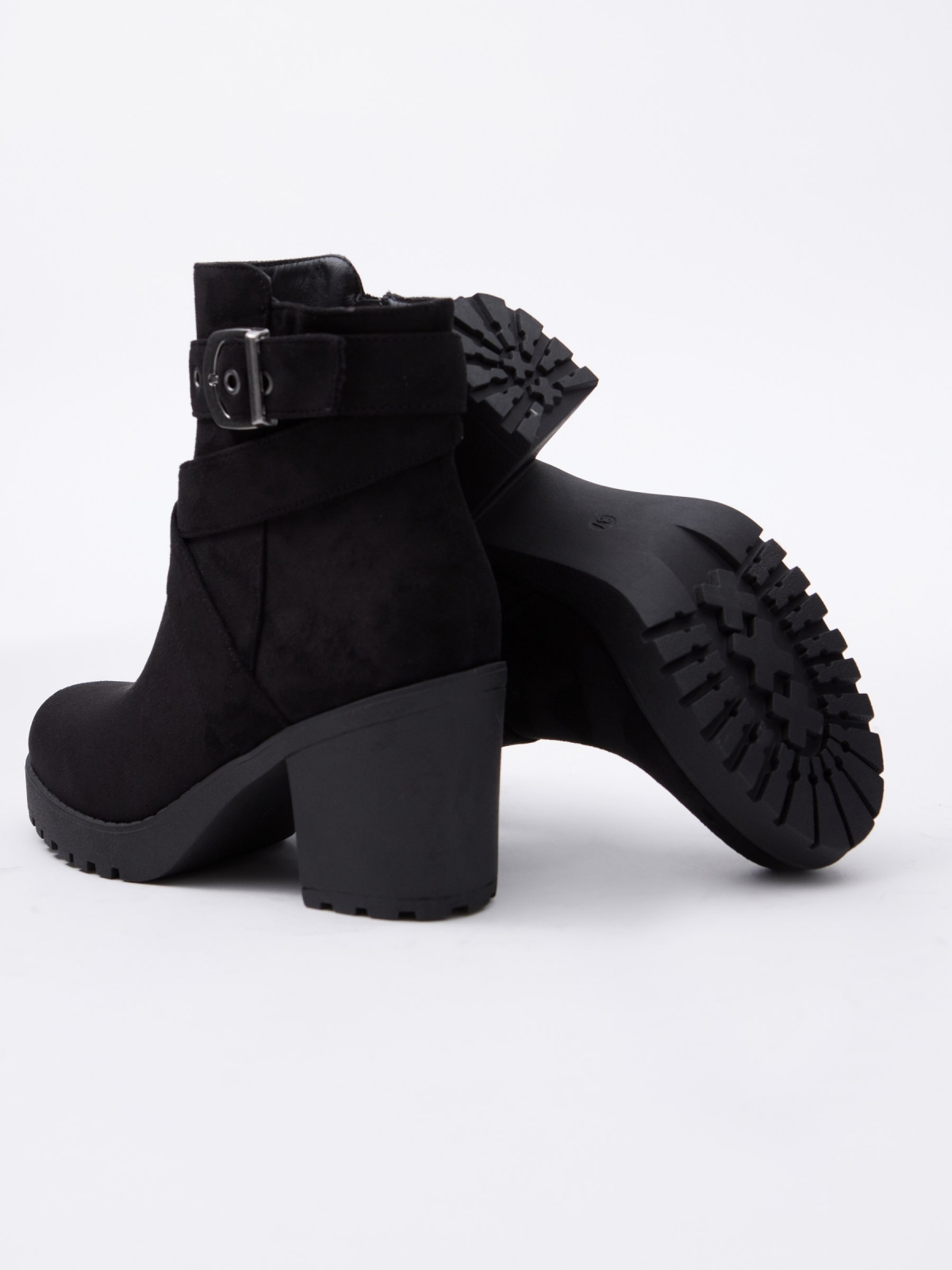 Black ankle boot with crossed straps and buckle black detail view