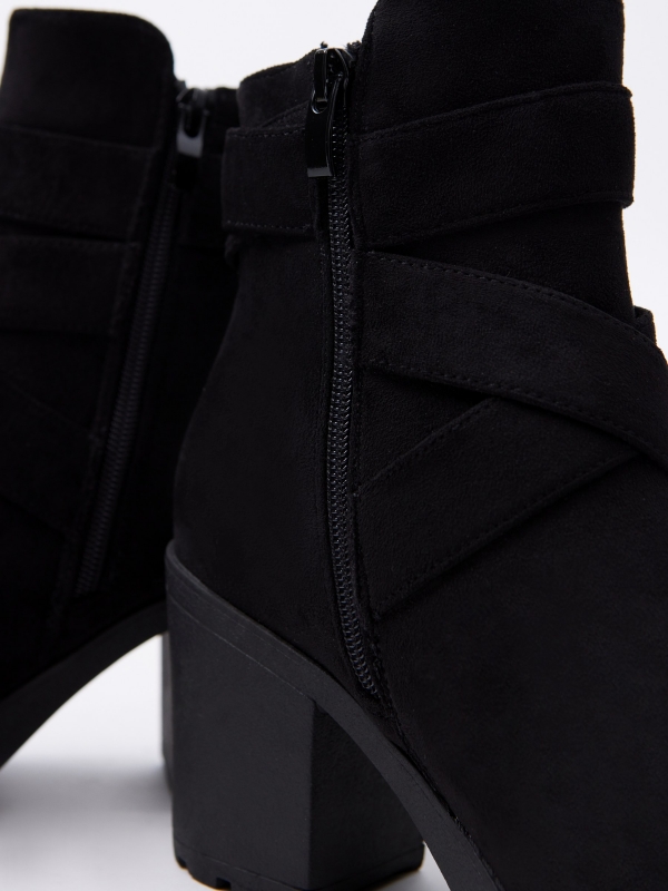 Black ankle boot with crossed straps and buckle black detail view