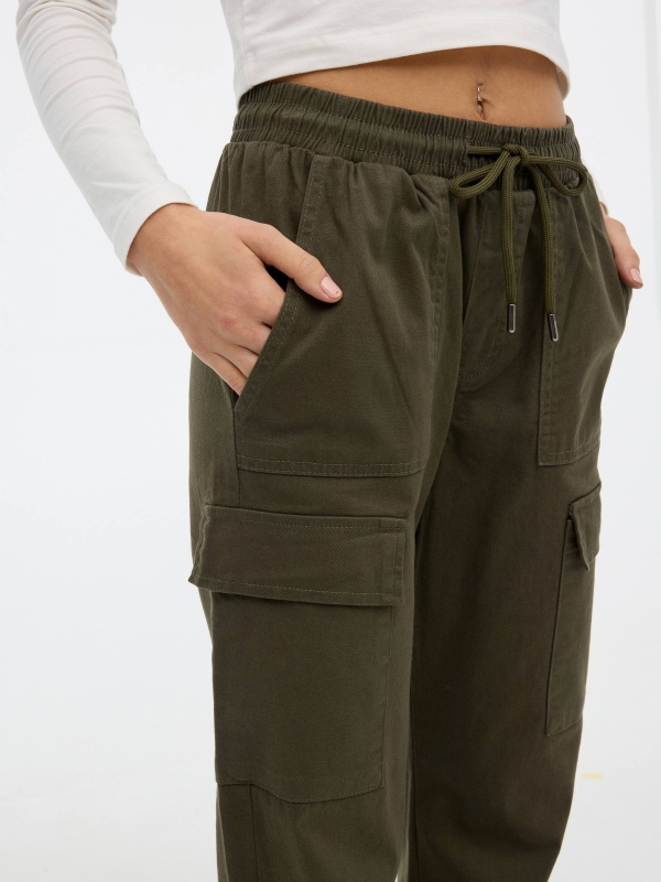 Cargo pants pockets khaki detail view