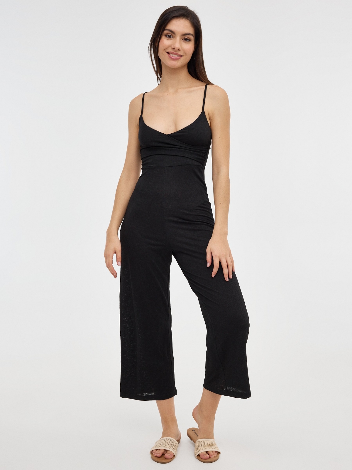 Black jumpsuit with crossover neckline black front view