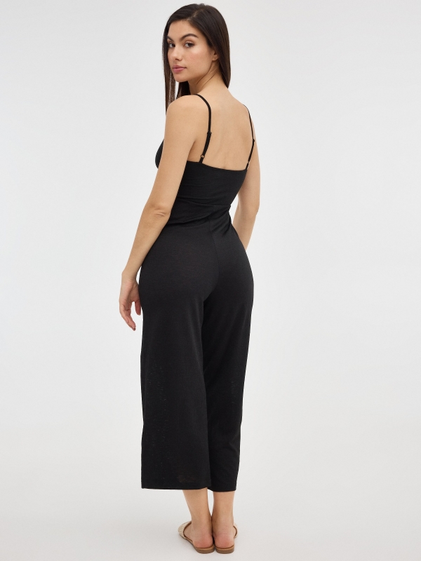Black jumpsuit with crossover neckline black middle front view