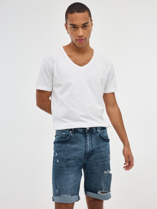 Ripped slim denim Bermuda shorts blue middle front view