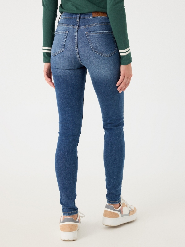 High-waisted skinny jeans with washed effect navy middle back view