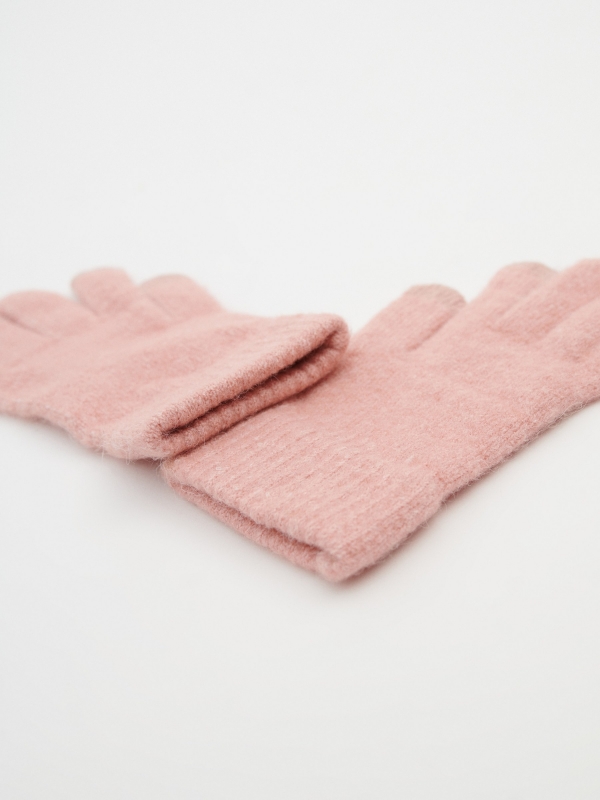 Pink knitted gloves pink aerial view