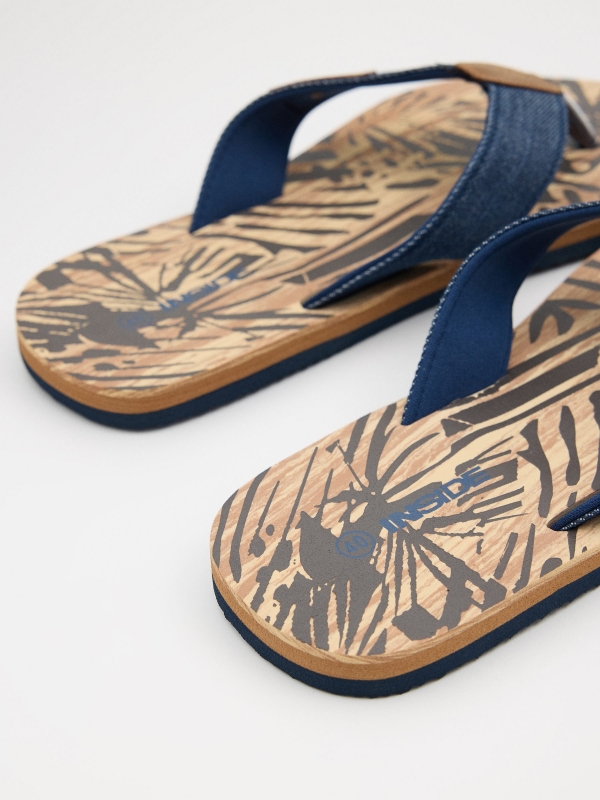 Blue denim thong sandal sand detail view