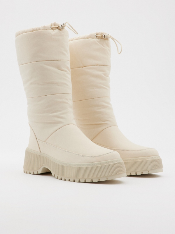 White padded boots beige 45º front view