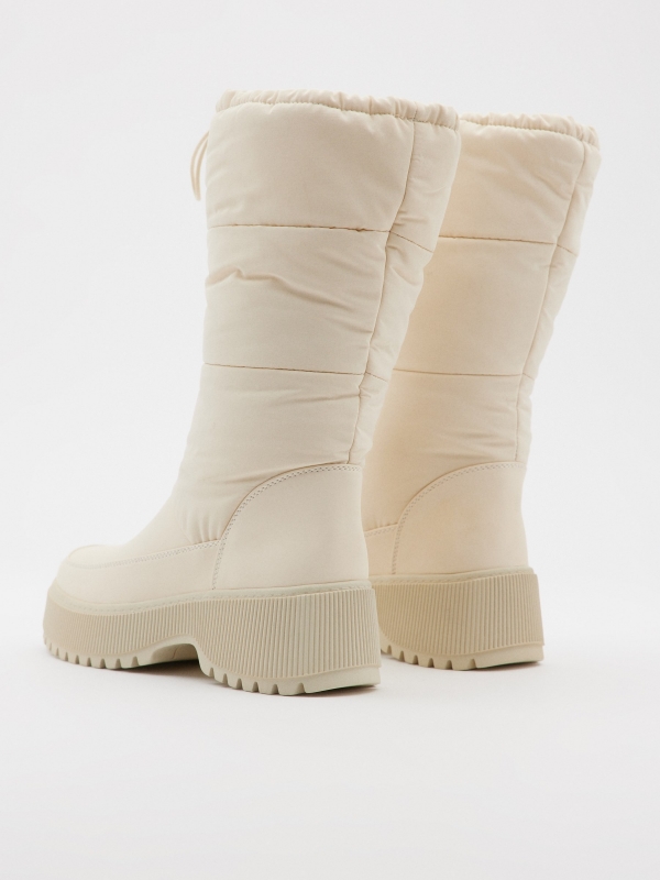 White padded boots beige 45º back view