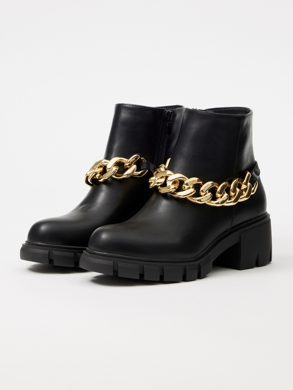 Golden chain high heel ankle boot black 45º front view