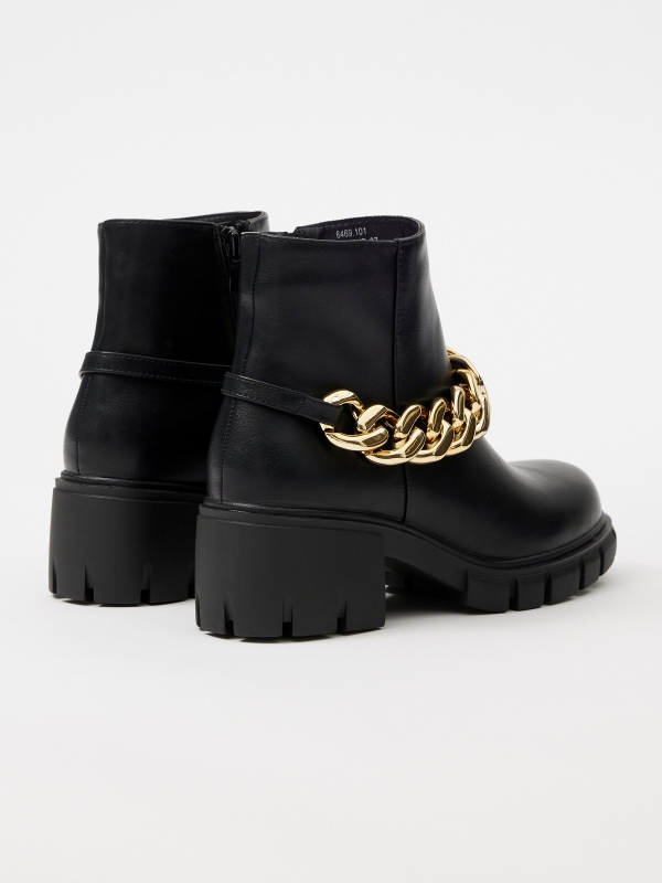 Golden chain high heel ankle boot black 45º back view