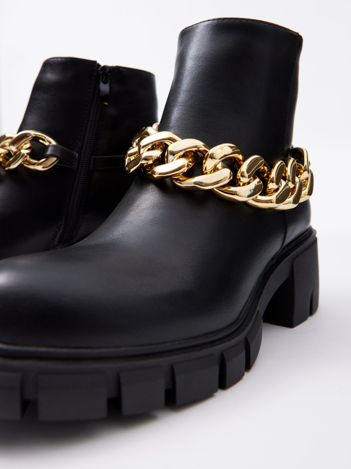 Golden chain high heel ankle boot black detail view