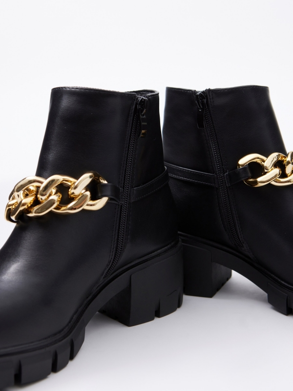 Golden chain high heel ankle boot black detail view