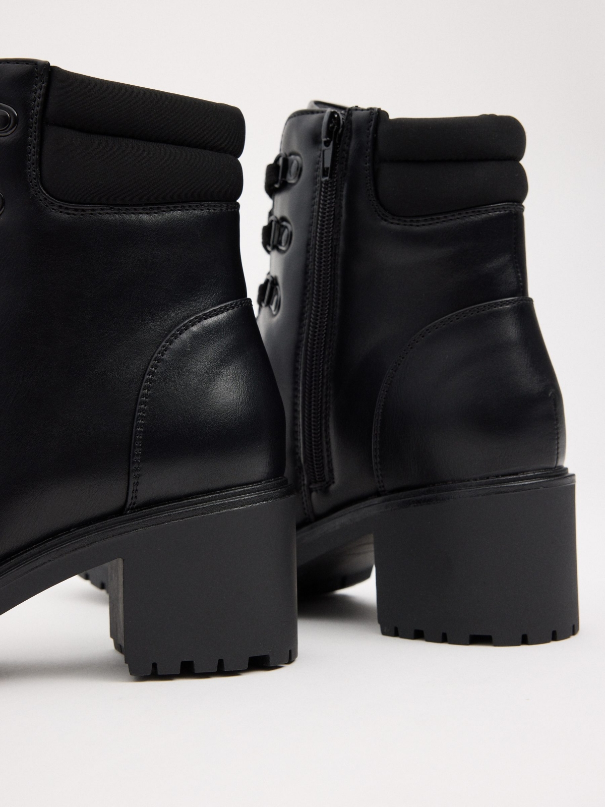 Black ankle boot with lace-up heel black detail view
