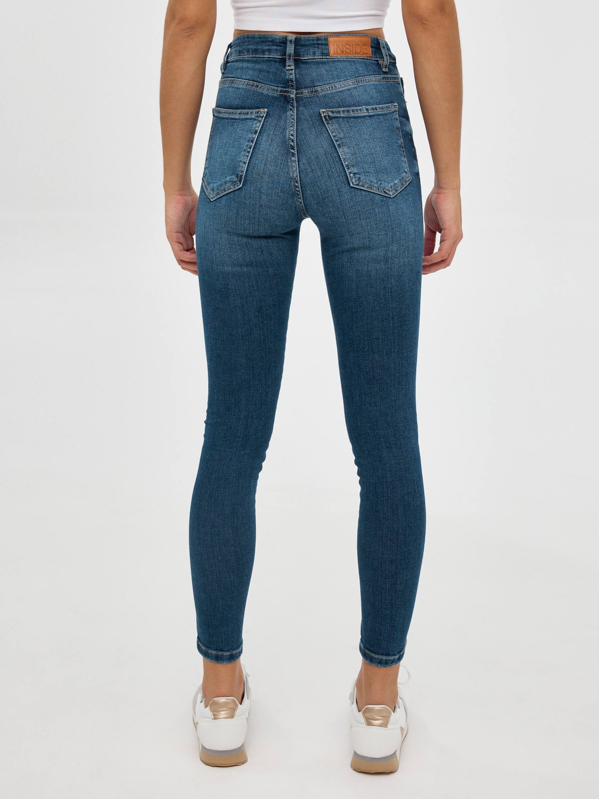 High rise skinny jeans blue middle back view