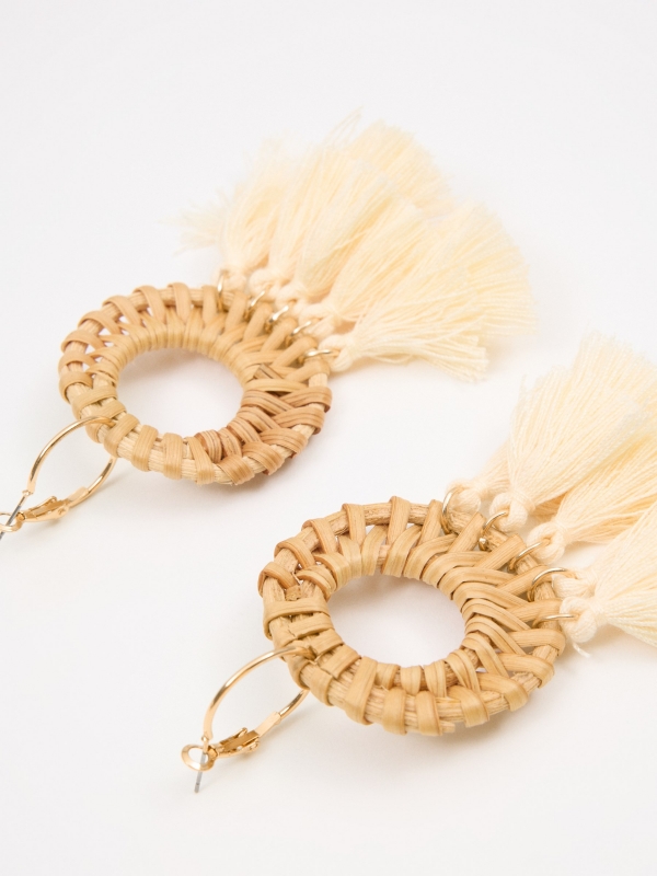 Wicker and fringe earrings beige foreground with a model