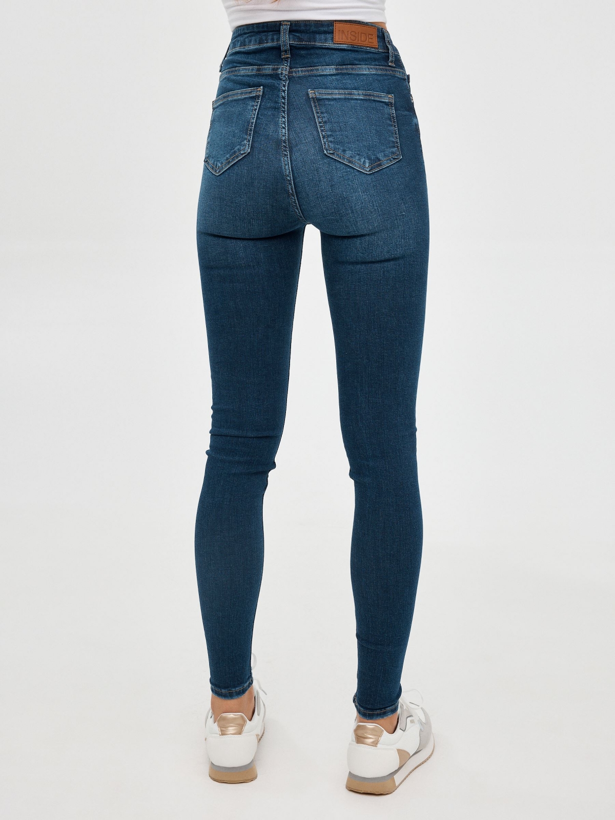 High rise skinny jeans dark blue middle back view