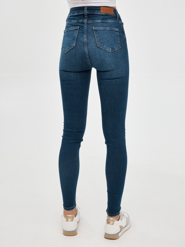 Jeans skinny tiro alto azul oscuro vista media trasera