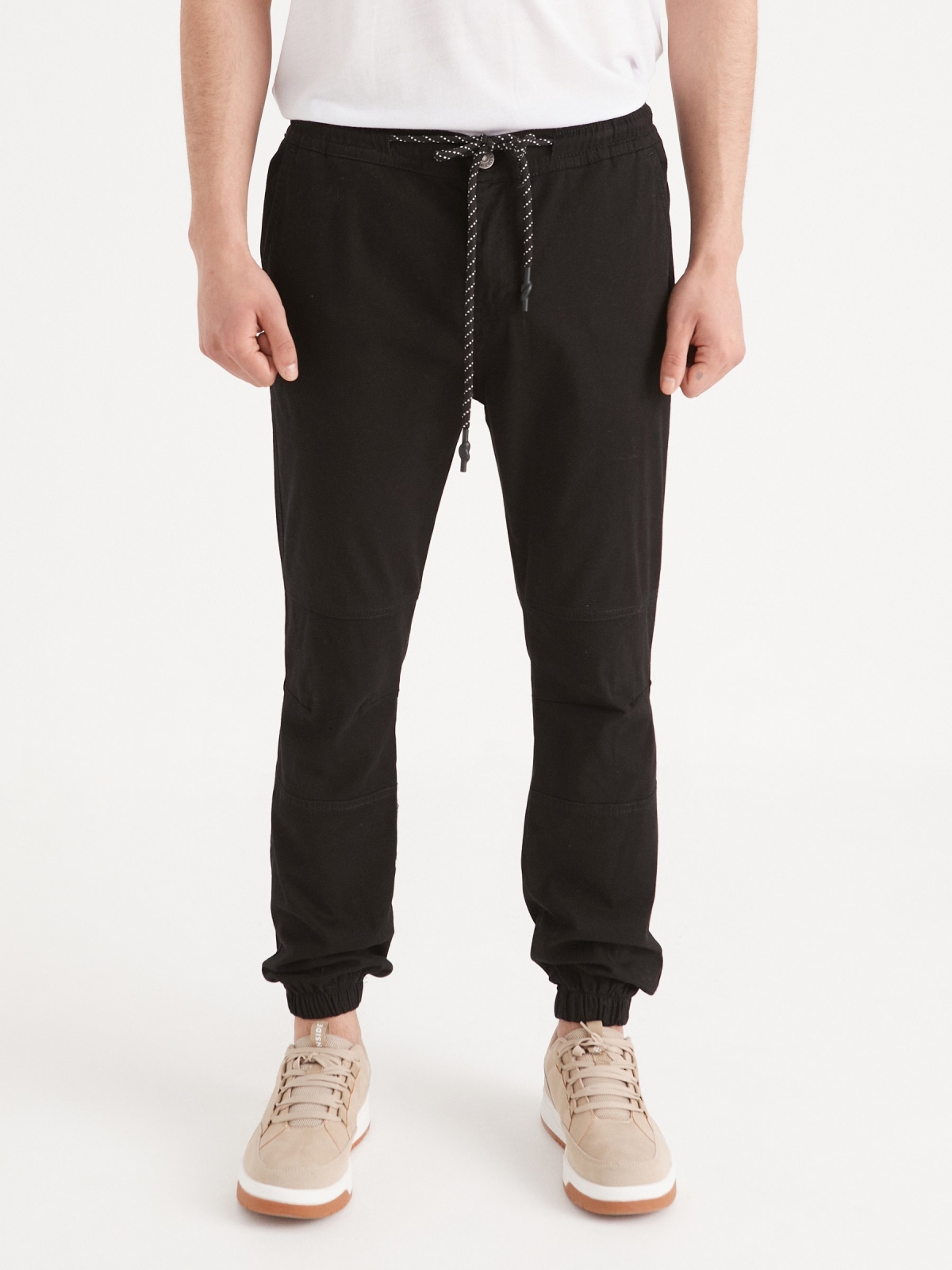 Joggers with seams black middle front view