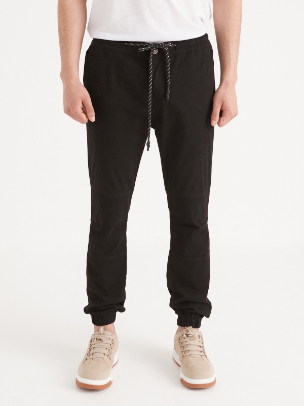 Joggers with seams black middle front view