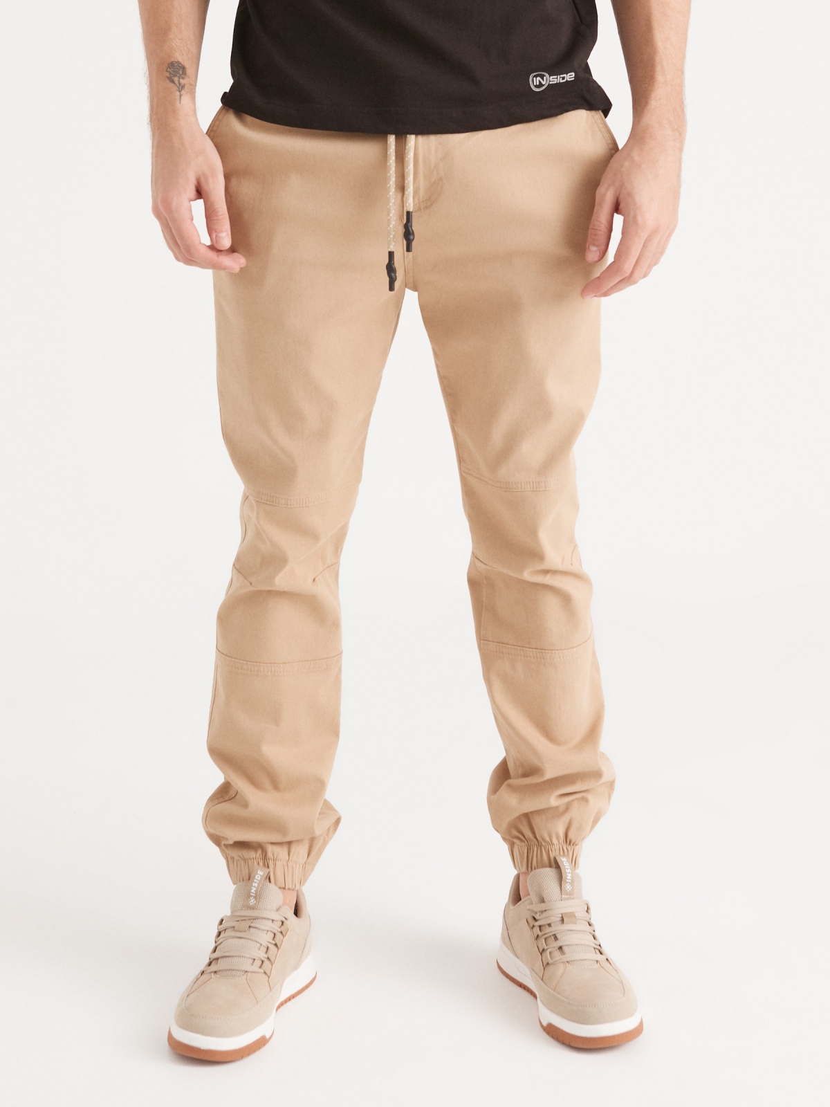 Joggers with seams beige middle front view