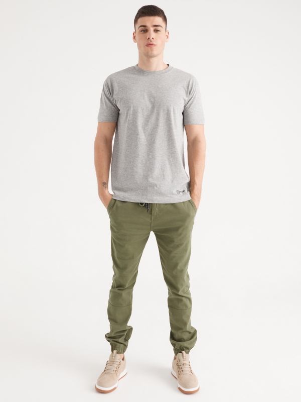 Joggers with seams green front view