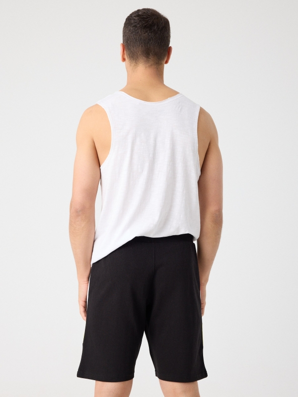 Combined bermuda jogger short with text black middle back view