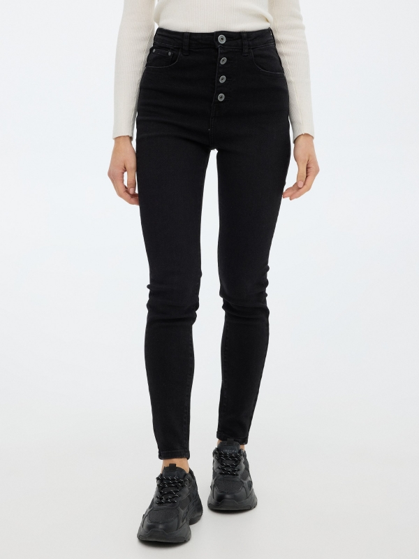 Skinny pants with buttons black middle front view