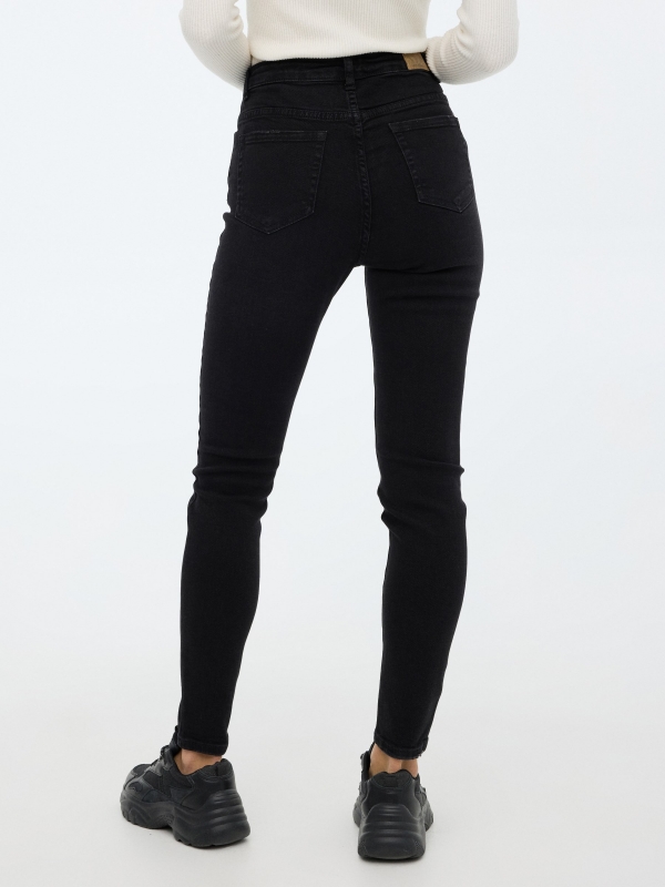 Skinny pants with buttons black middle back view