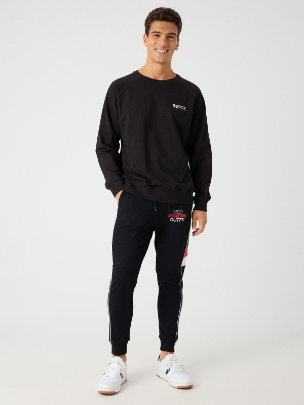 Jogger pants with mixed details black front view
