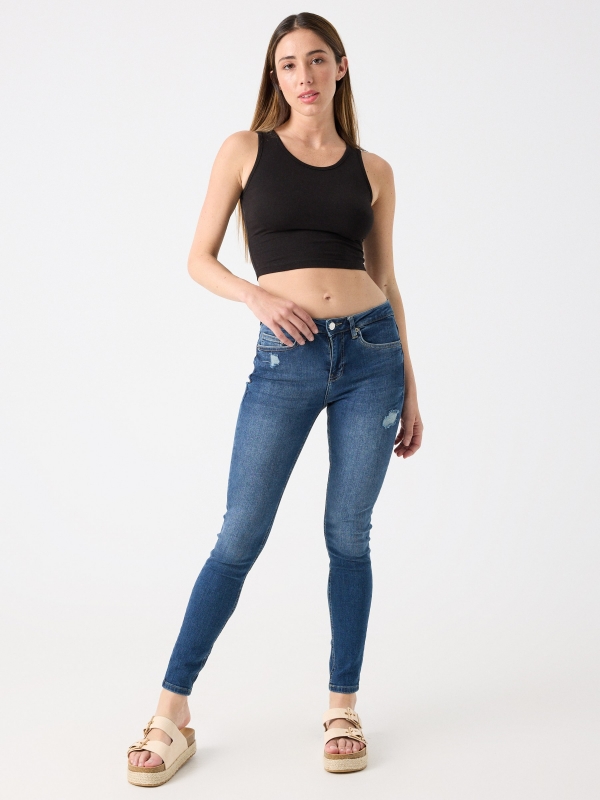 Ripped mid-rise skinny jeans blue front view