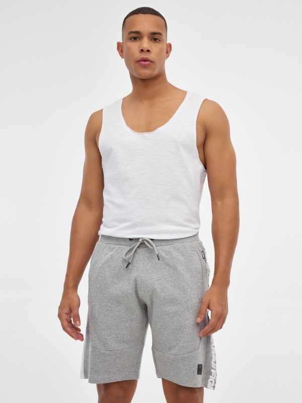 Bermuda jogger shorts with text grey middle front view