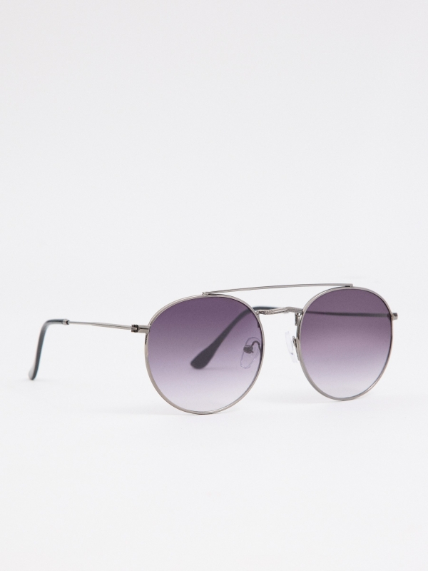 Round metal sunglasses silver foreground with a model