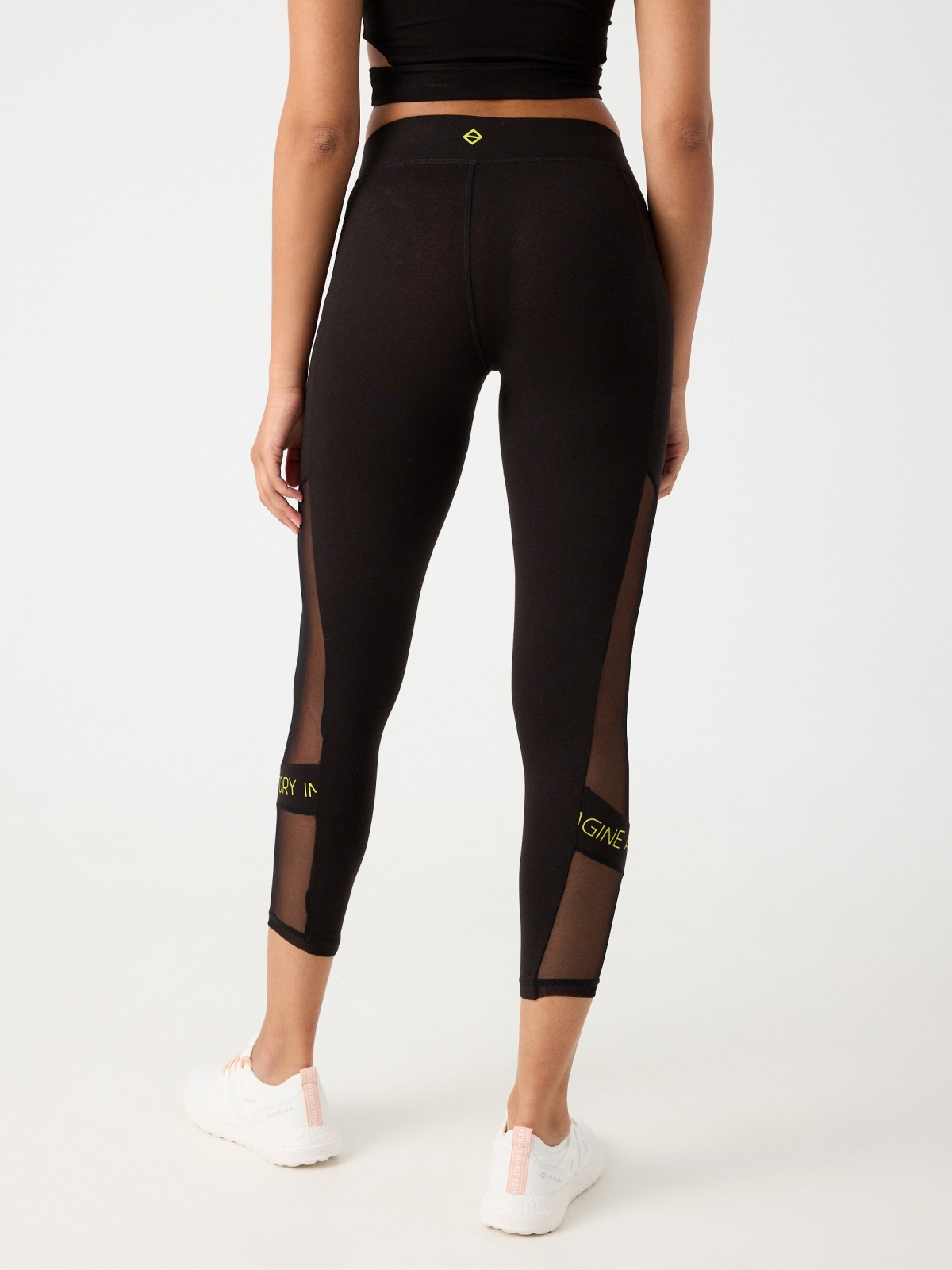 Neon text leggings black middle back view