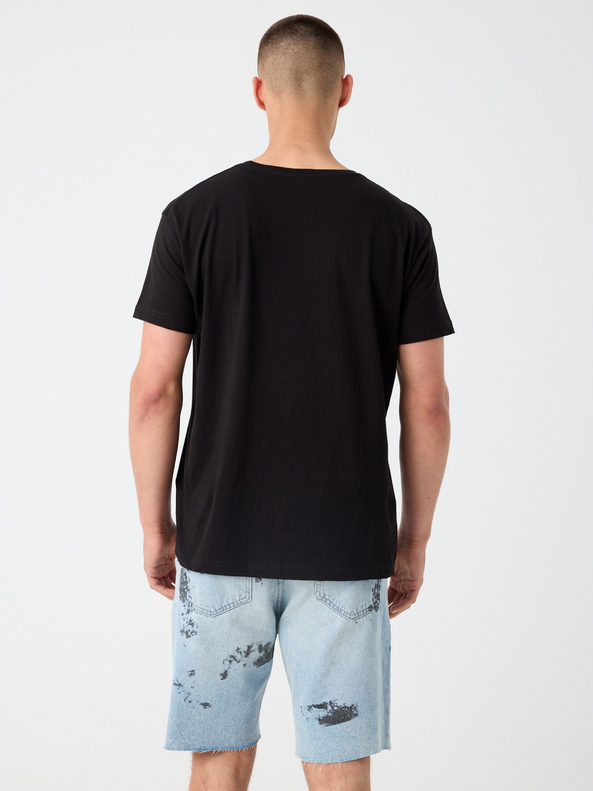 Ripped worn-effect denim bermuda shorts light blue middle back view