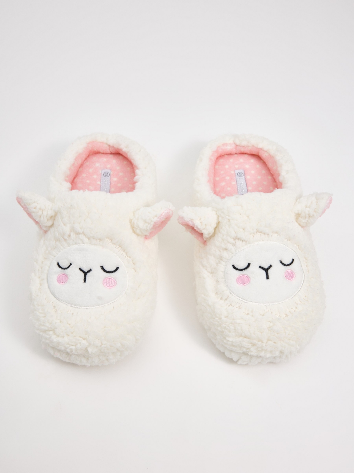 Little sheep slippers off white foreground