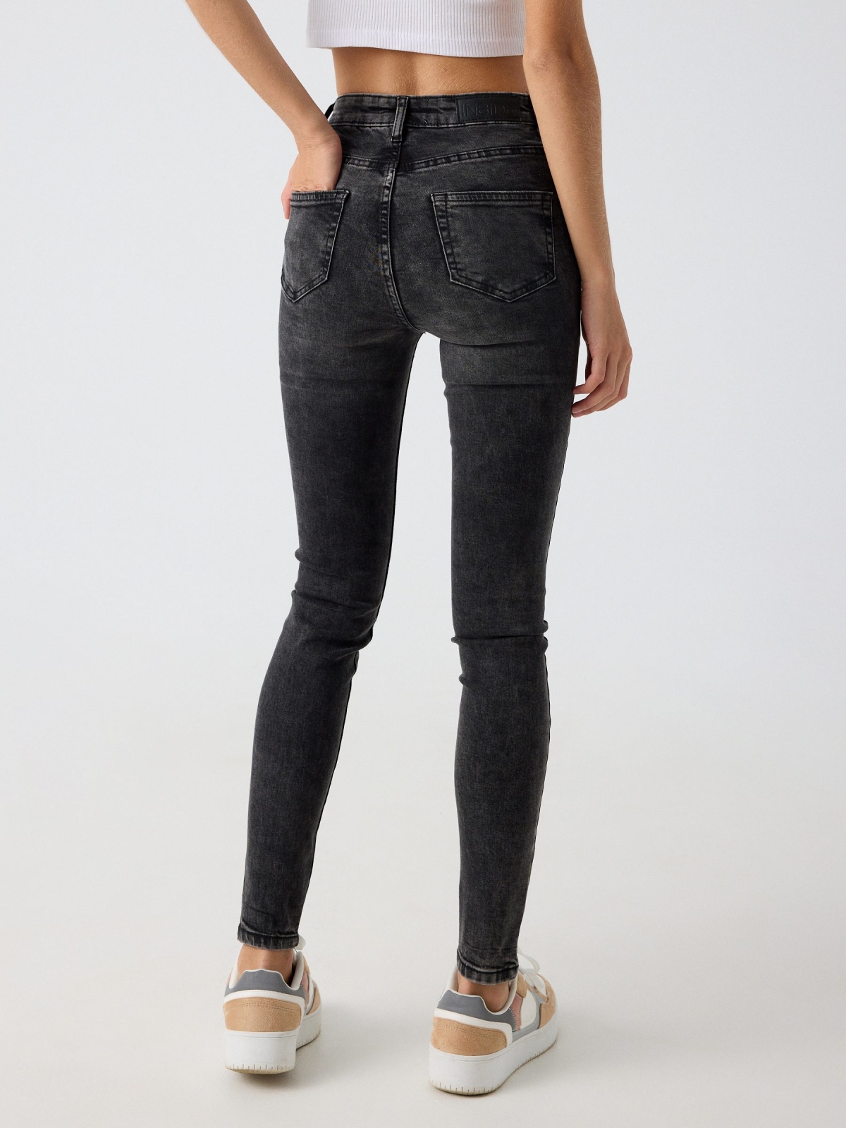 Washed black high waisted skinny jeans black middle back view