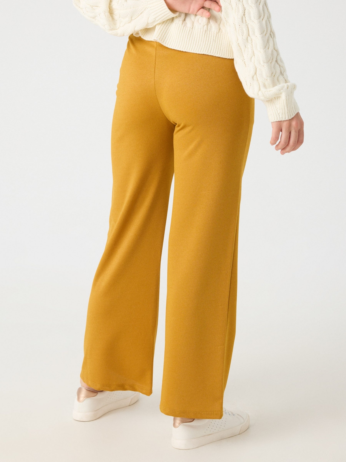 Flare lurex pants mustard middle back view