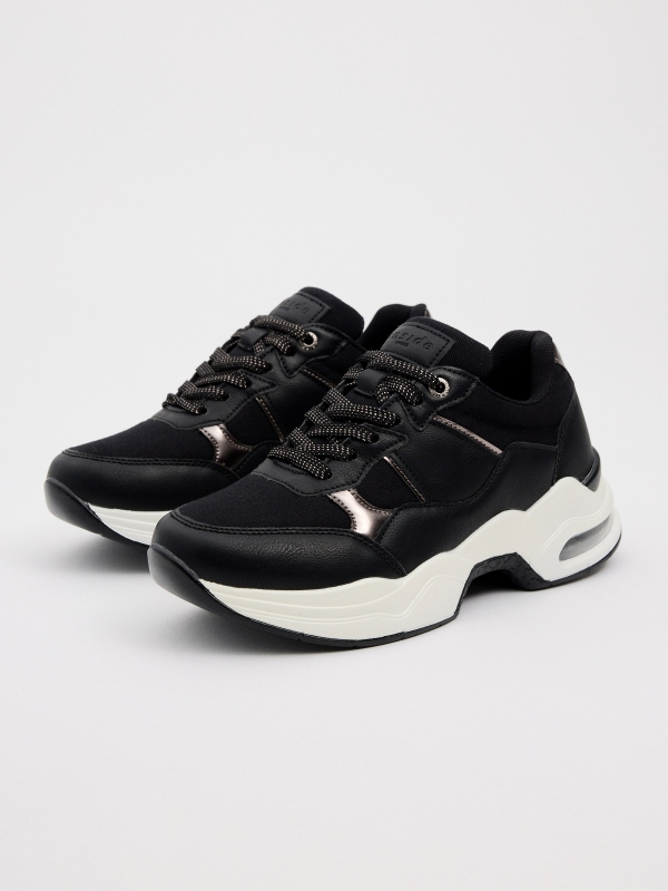 Air chamber volume sole sneaker black 45º front view