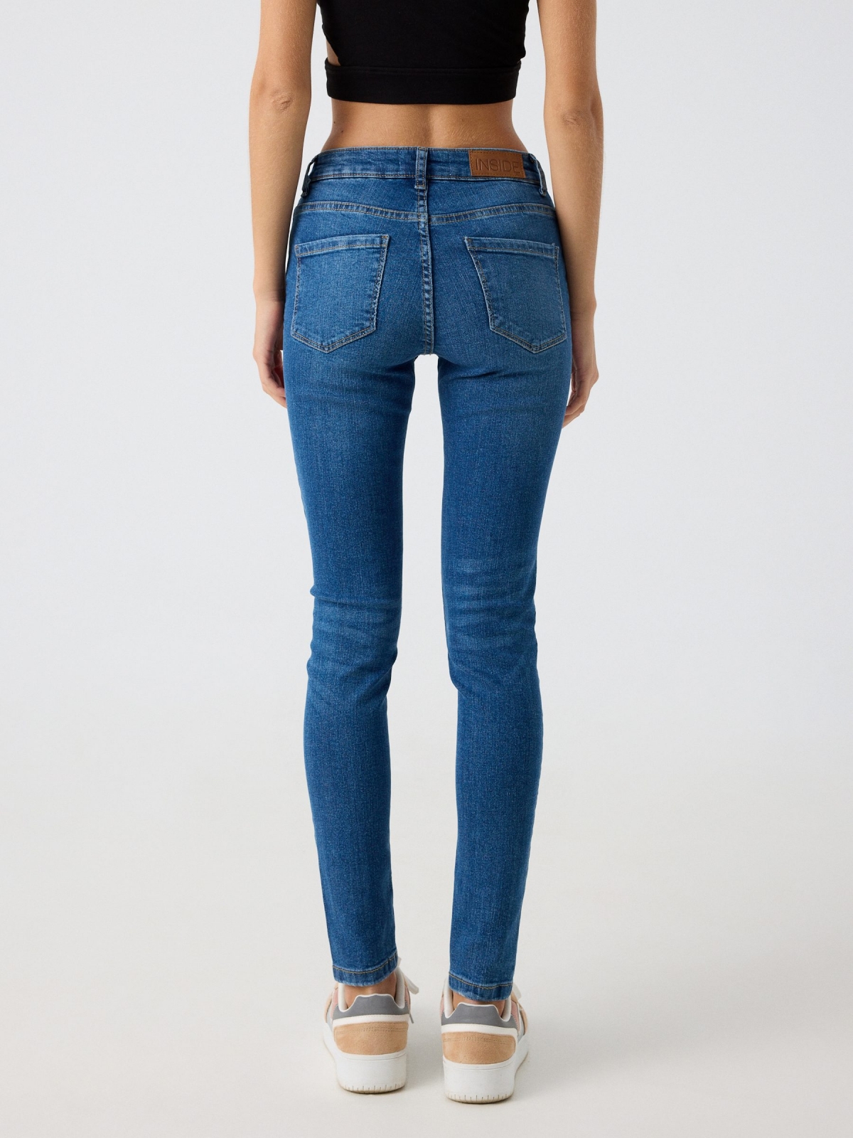 Mid-rise skinny jeans with washed effect ducat blue middle back view