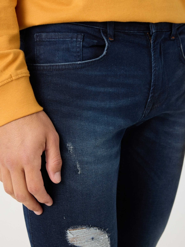 Ripped washed blue super slim jeans navy detail view