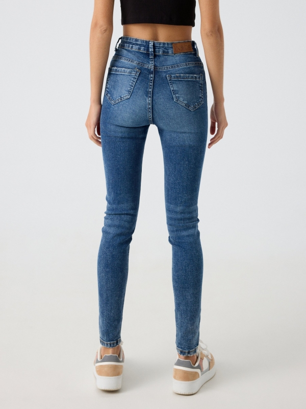 High waist skinny jeans with five pockets steel blue middle back view