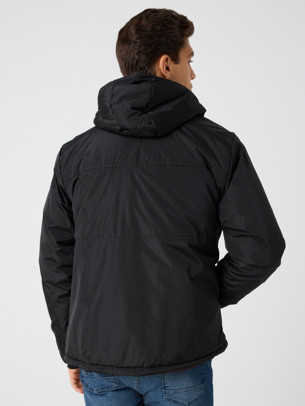 Hooded black parka black middle back view