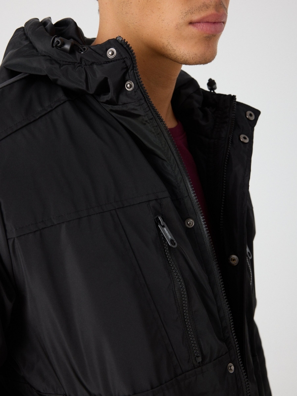 Hooded black parka black detail view