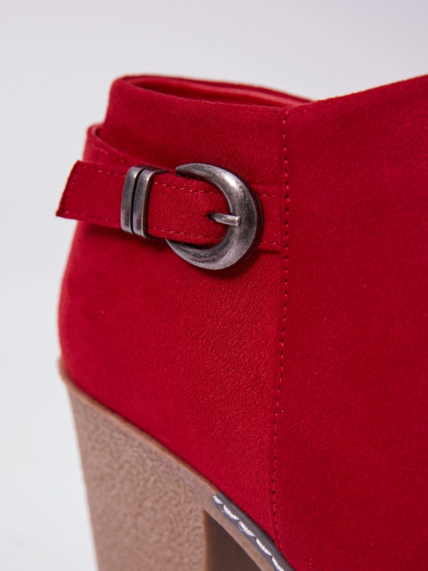 Buckle heel bootie red with a model