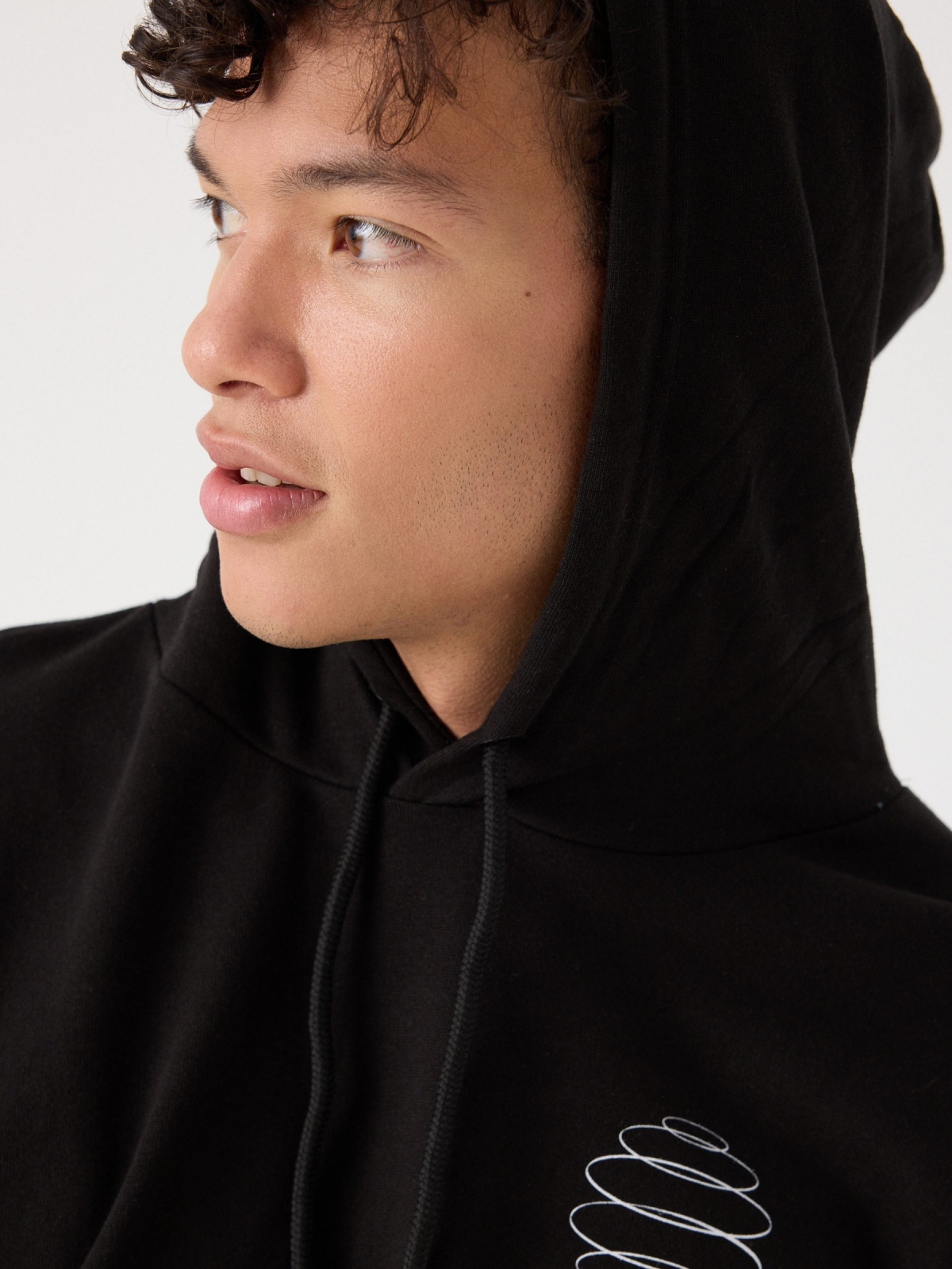Black hoodie with pocket black detail view