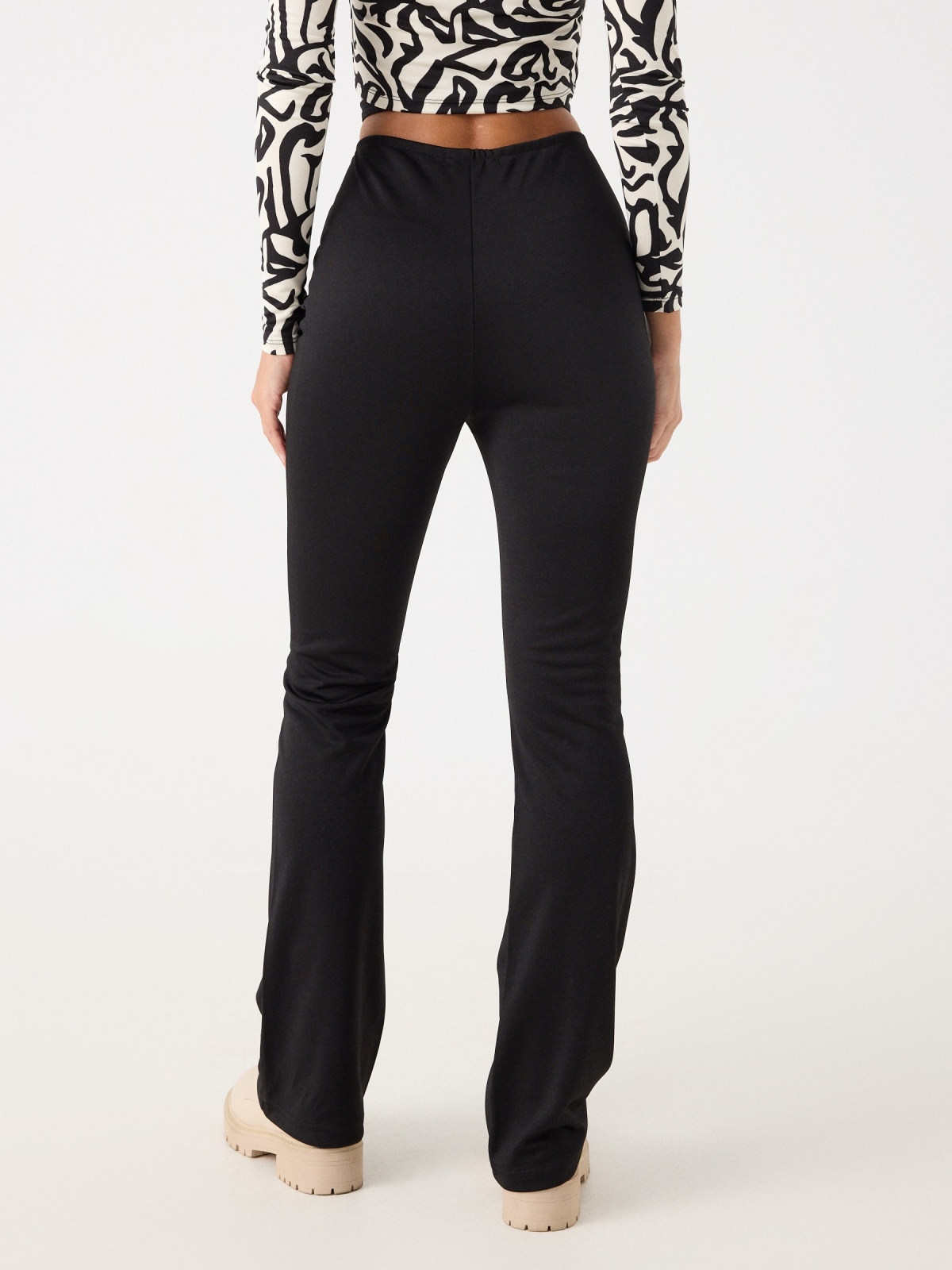 Flared pants with tie waist black middle back view