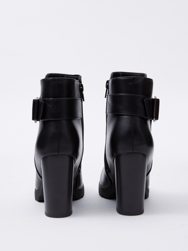 Black leather effect ankle boot with buckle black detail view