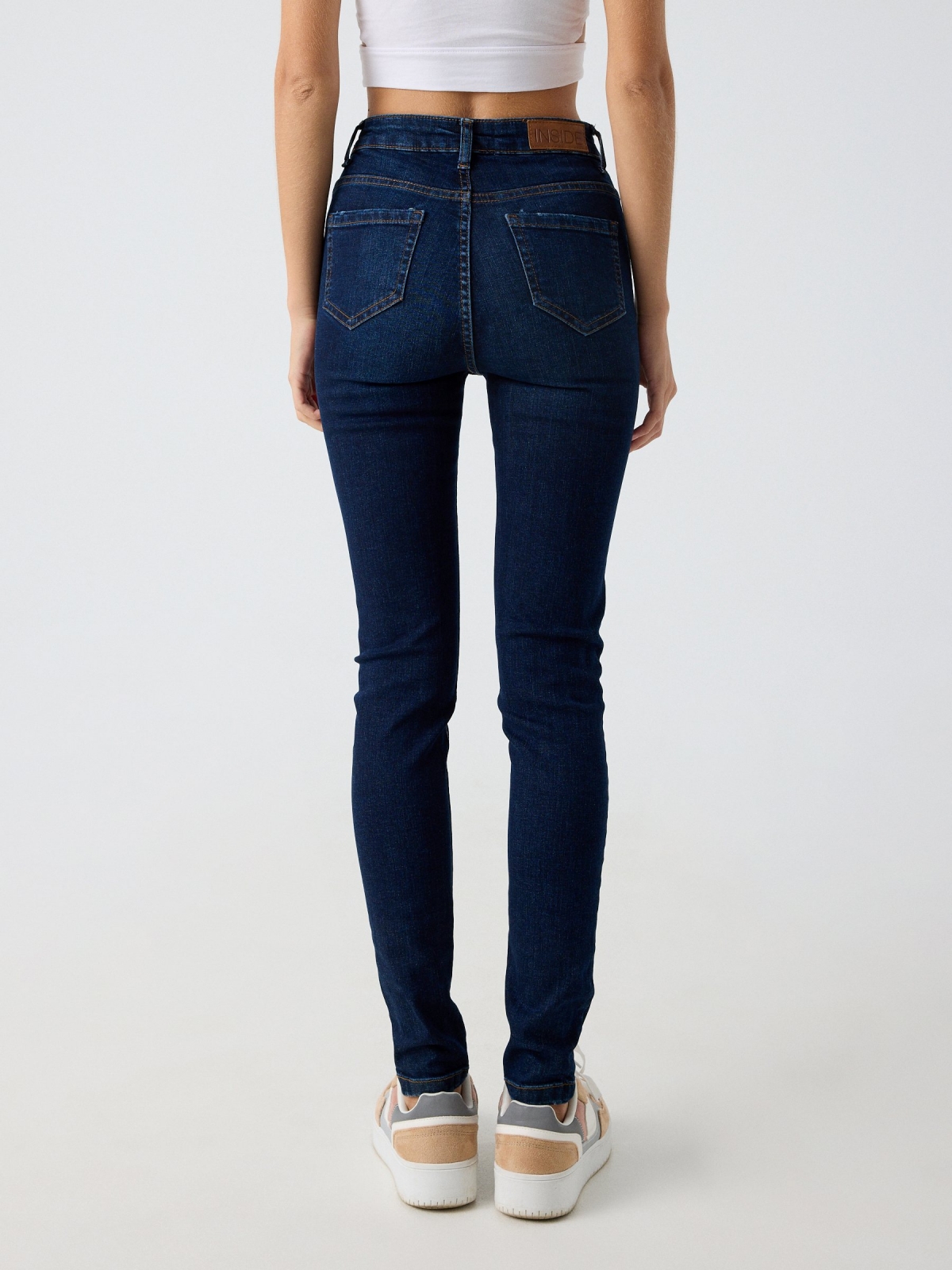 Blue high waisted skinny jeans blue middle back view